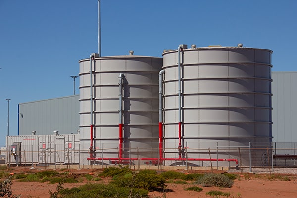 Two circular coloured steel tanks