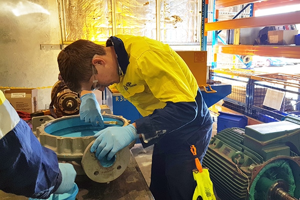 Technician working on pump